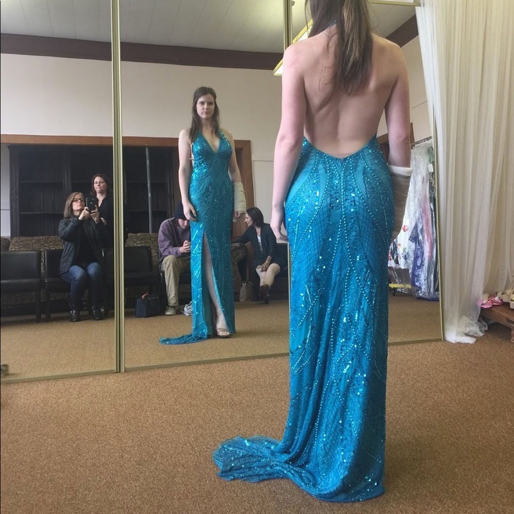 Fully beaded evening gown with slit. Size 4